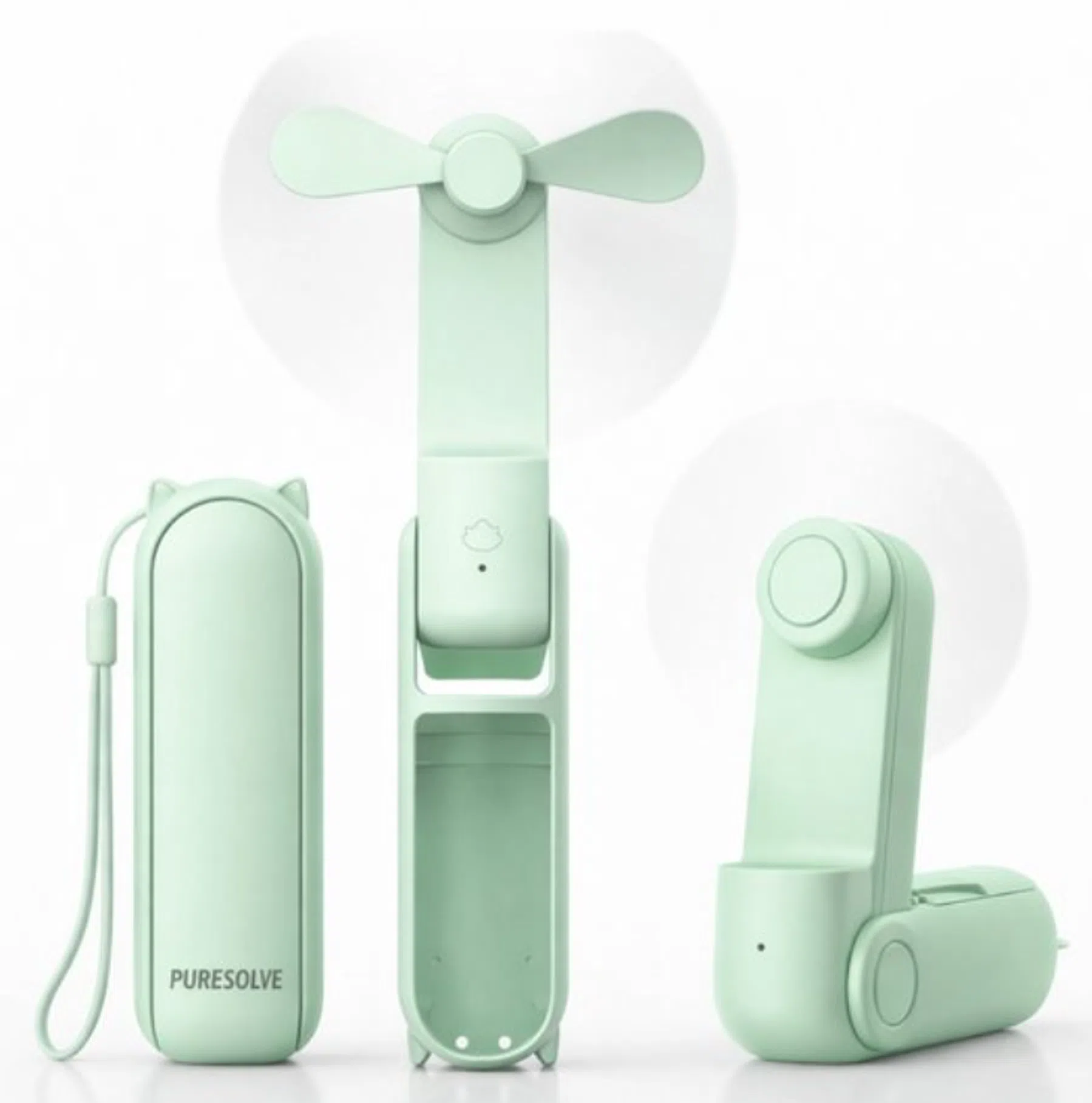 Oplaadbare mini- & handventilator bij de hand in het groen